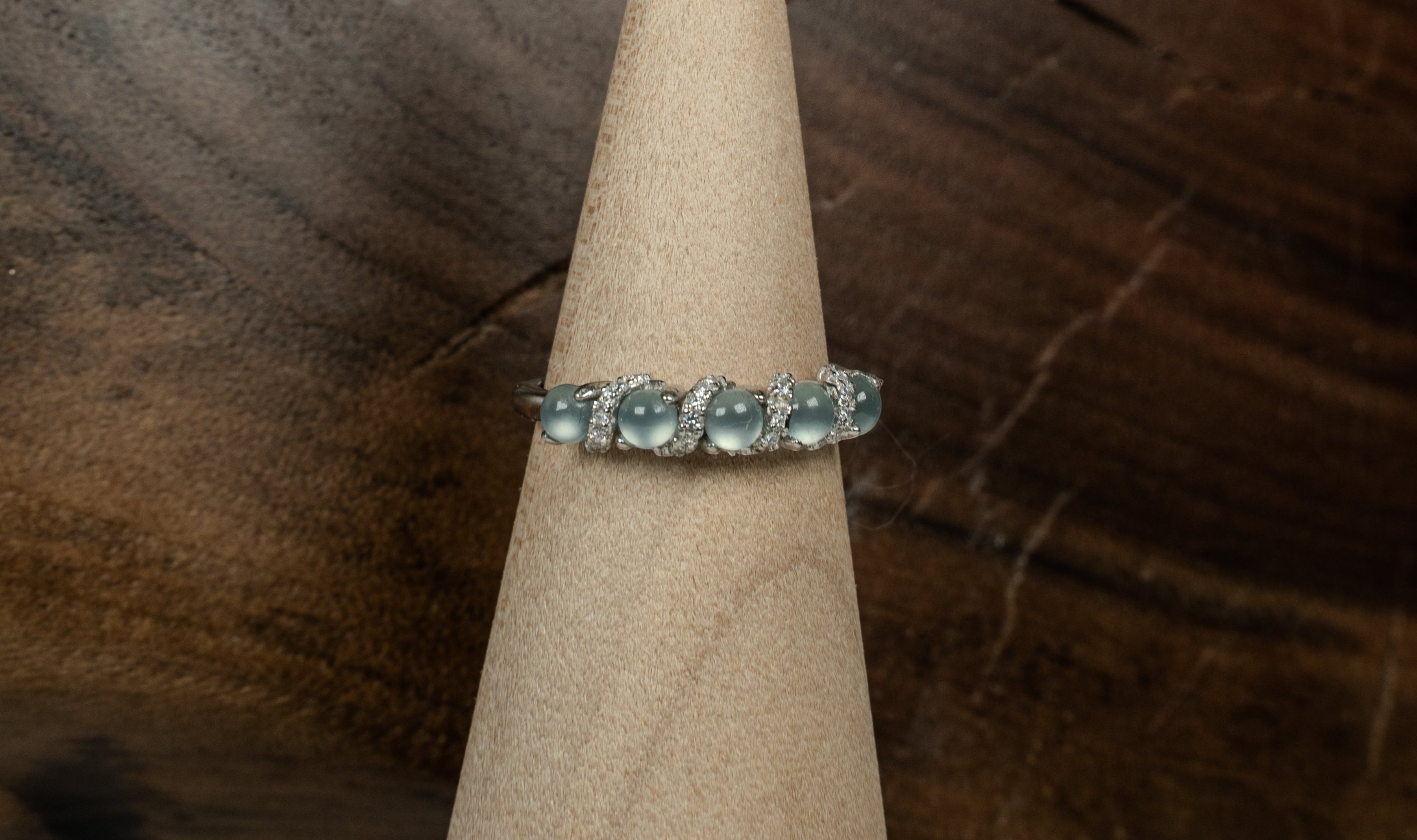 Findingyoyo adjustable ring featuring blue Guatemalan jadeite cabochons and zircon accents in rhodium-plated silver.