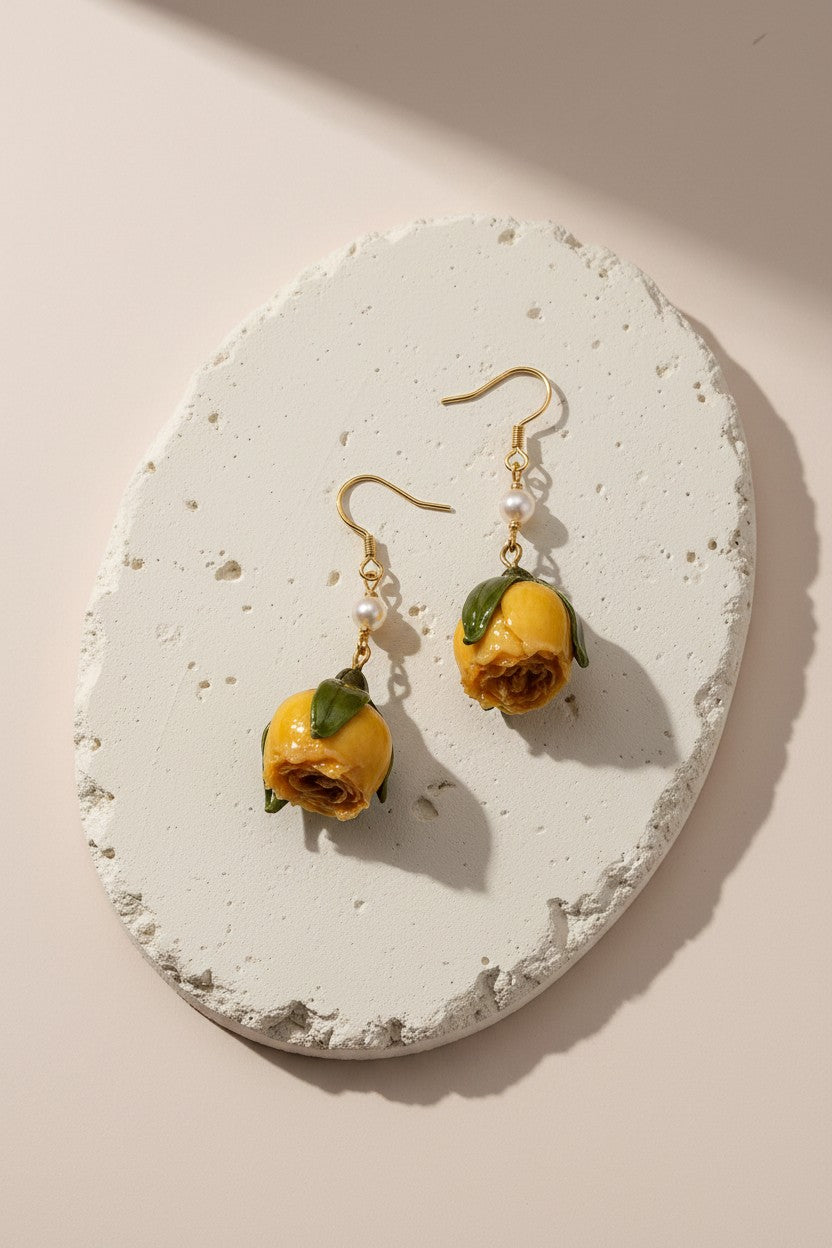 Findingyoyo Rose Bible earrings featuring real dried yellow roses and freshwater pearls on gold-coated sterling silver.