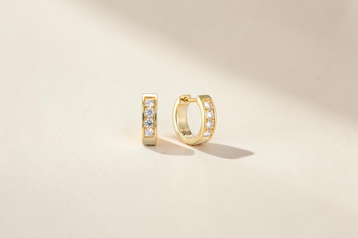 Findingyoyo gold hoop earrings featuring a row of sparkling lab-grown diamonds set in 14K gold plated sterling silver.