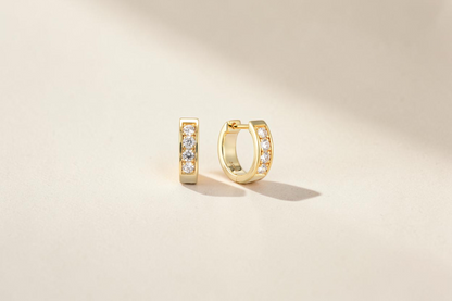 Findingyoyo gold hoop earrings featuring a row of sparkling lab-grown diamonds set in 14K gold plated sterling silver.