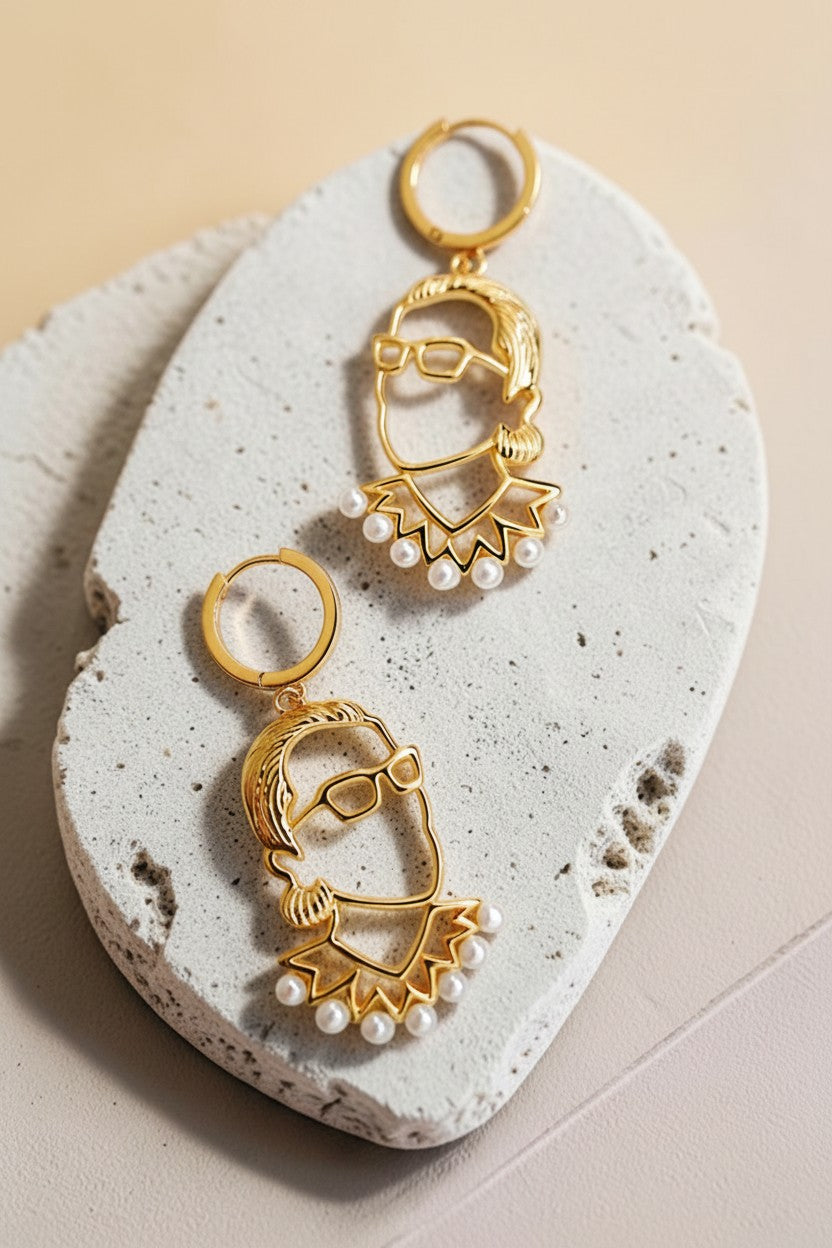 Findingyoyo gold-gilded sterling silver earrings featuring a stylized portrait with freshwater pearl accents.