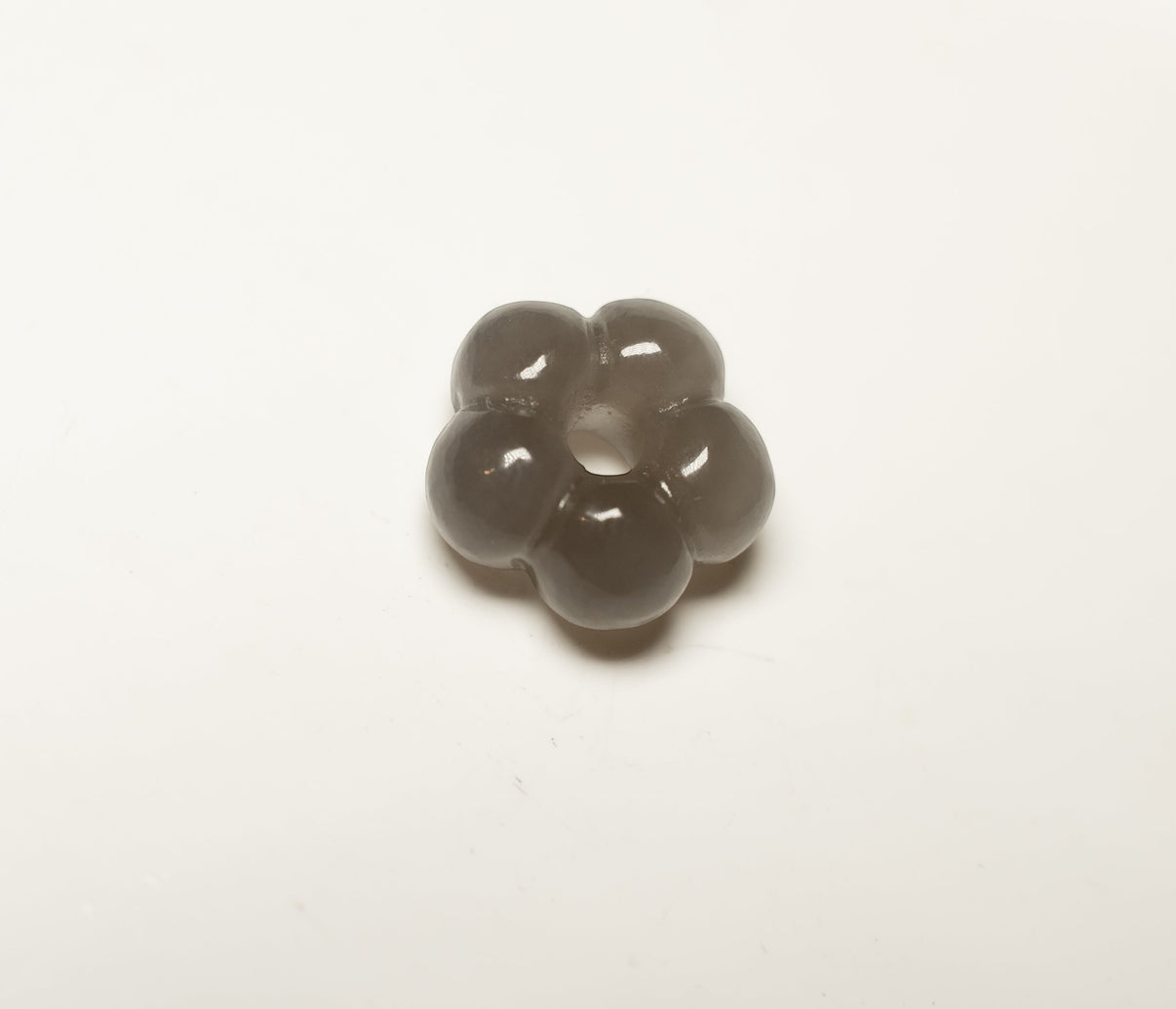 Findingyoyo hand-carved grey Hetian jade flower pendant with a central opening for charms