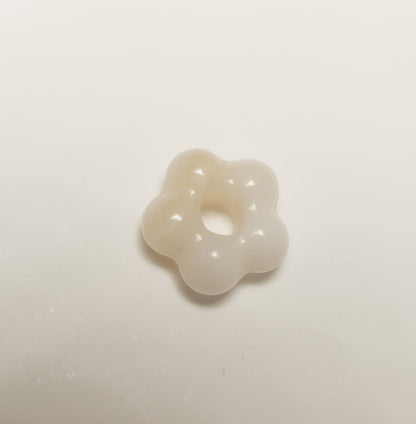 Findingyoyo hand-carved ivory Hetian jade flower pendant with a smooth, organic petal shape.