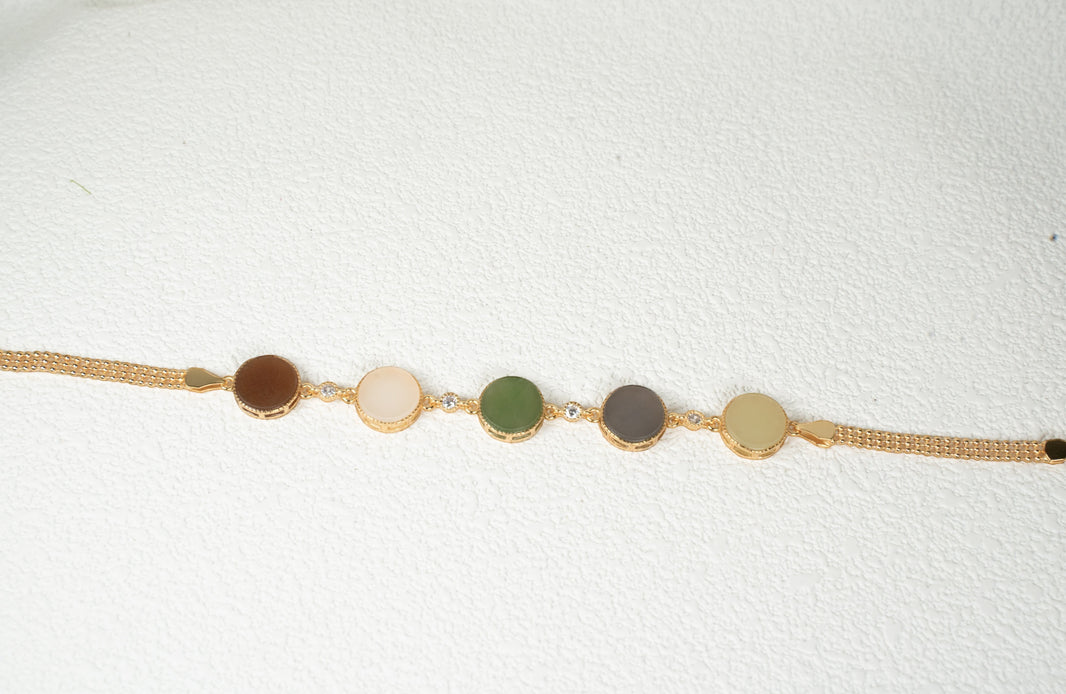 Findingyoyo Full Fortune bracelet featuring five round multi-colored Hetian jade stones with gold vermeil accents.