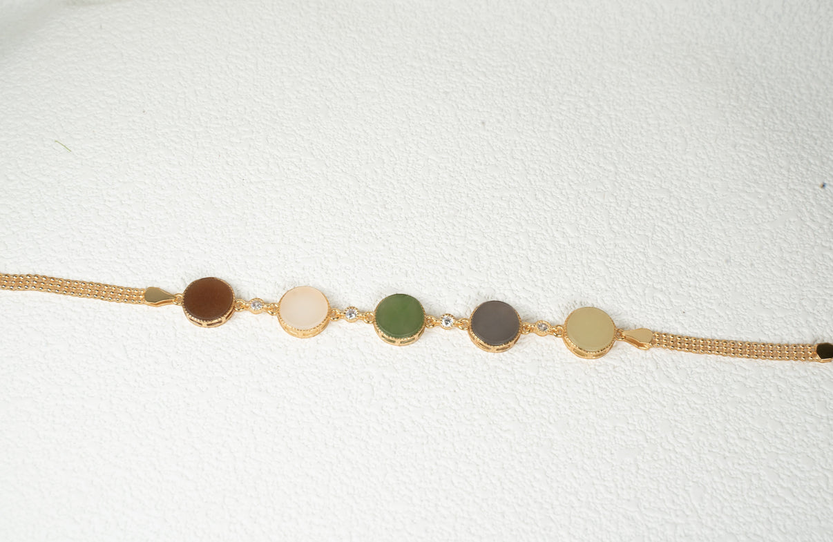 Findingyoyo Full Fortune bracelet featuring five round multi-colored Hetian jade stones with gold vermeil accents.