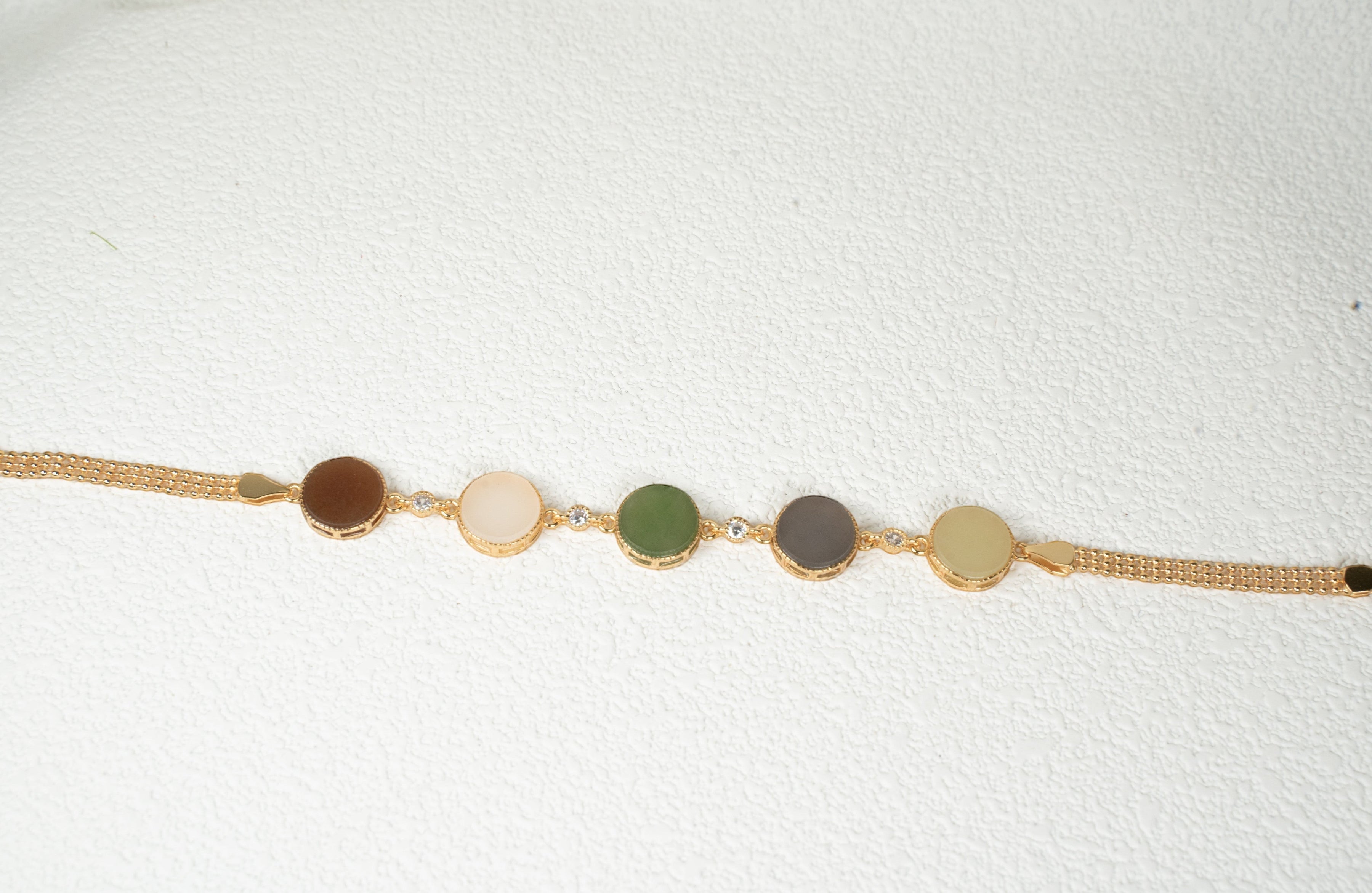 Findingyoyo Full Fortune bracelet featuring five round multi-colored Hetian jade stones with gold vermeil accents.