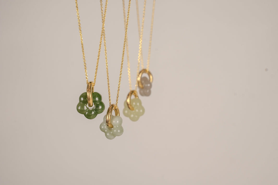 Findingyoyo Jardin necklaces featuring hand-carved natural Hetian jade flower pendants on 18K gold vermeil chains.