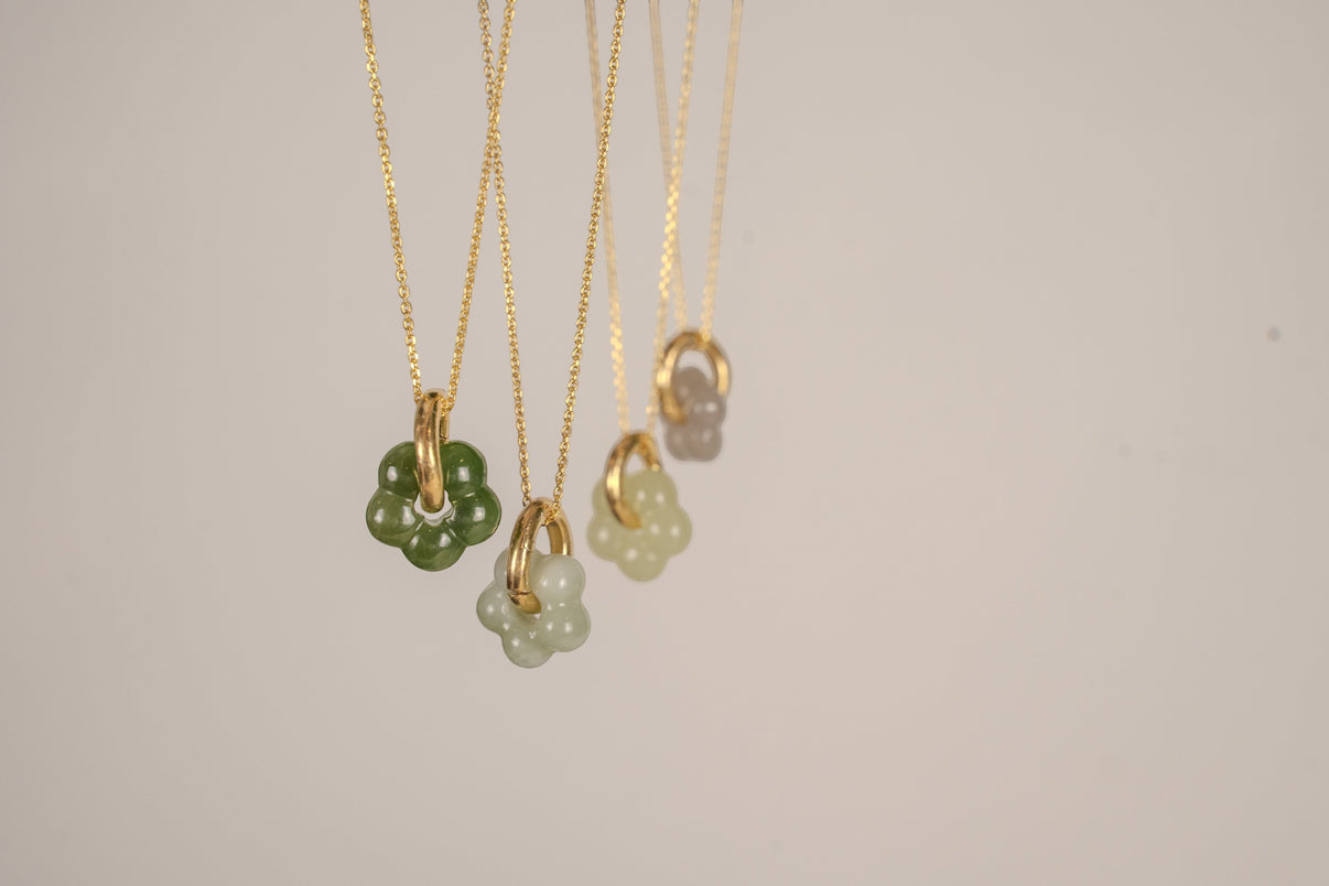 Findingyoyo Jardin necklaces featuring hand-carved natural Hetian jade flower pendants on 18K gold vermeil chains.