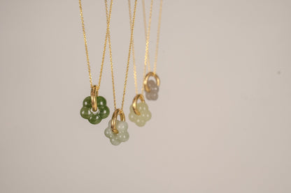 Findingyoyo Jardin necklaces featuring hand-carved natural Hetian jade flower pendants on 18K gold vermeil chains.