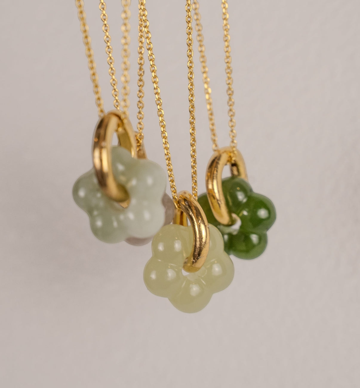 Findingyoyo Jardin necklace featuring hand-carved natural Hetian jade flower pendants on 18K gold vermeil chains.