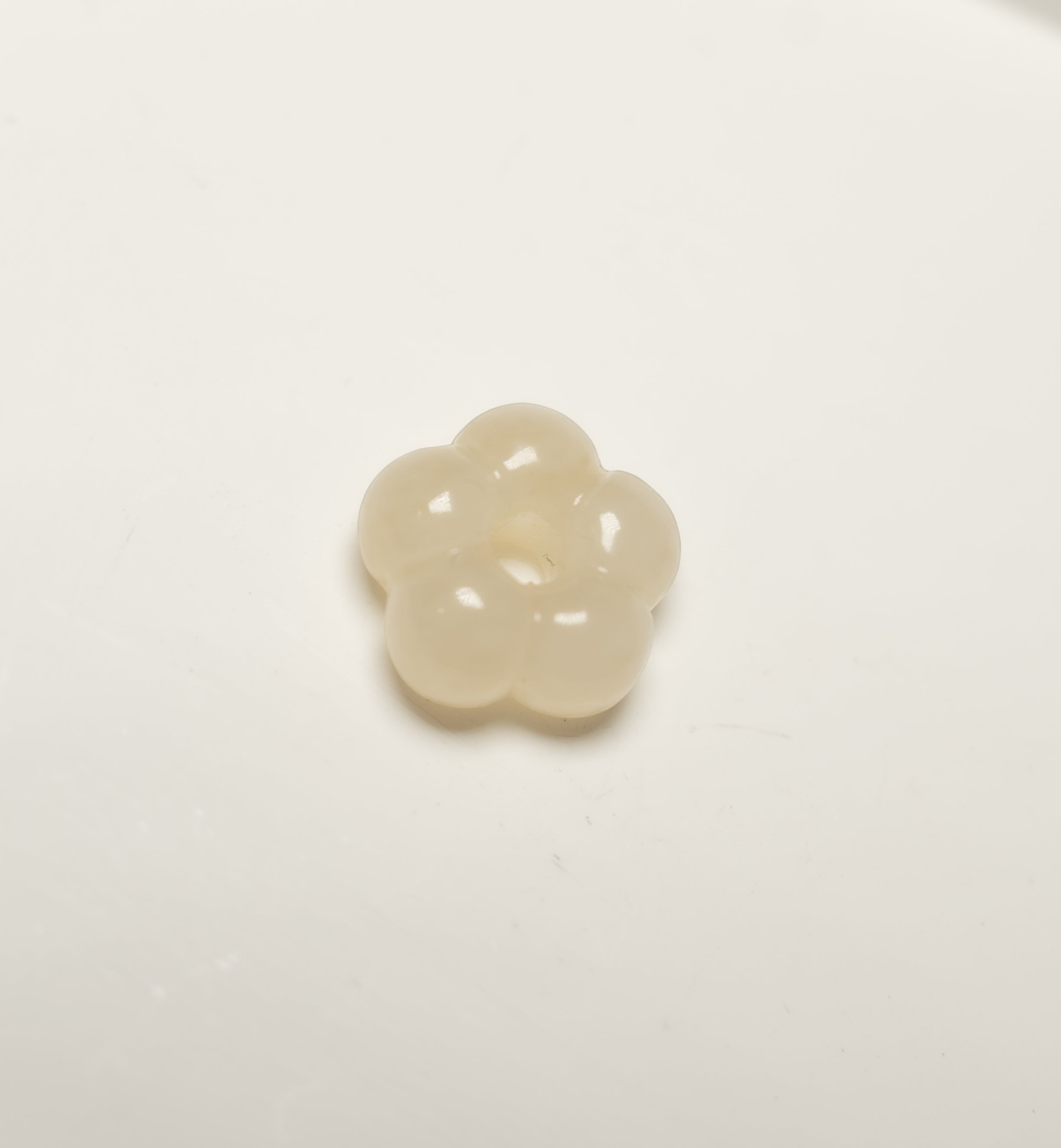 Findingyoyo hand-carved ivory-toned Hetian jade flower pendant with a smooth, polished finish.