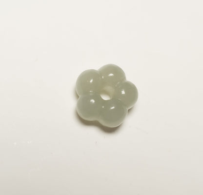 Findingyoyo Jardin necklace pendant featuring a hand-carved pale celadon Hetian jade flower with a central clasp ring