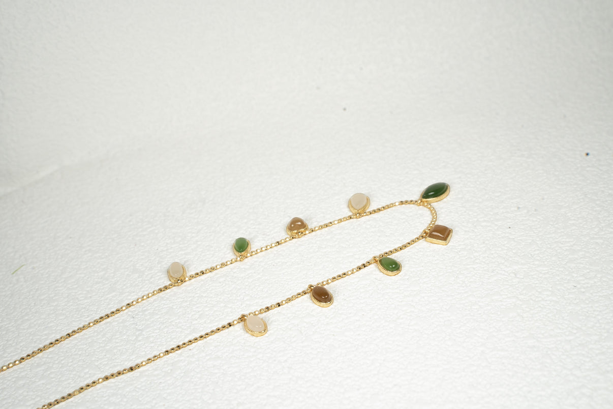 Findingyoyo Full Fortune necklace featuring multi-colored Hetian jade charms on a delicate gold vermeil chain.