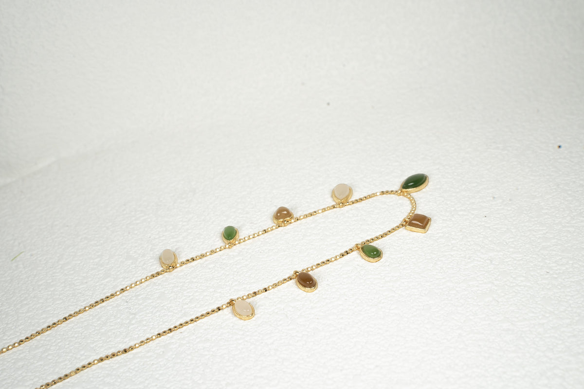 Findingyoyo Full Fortune necklace featuring multi-colored Hetian jade charms on a delicate gold vermeil chain.
