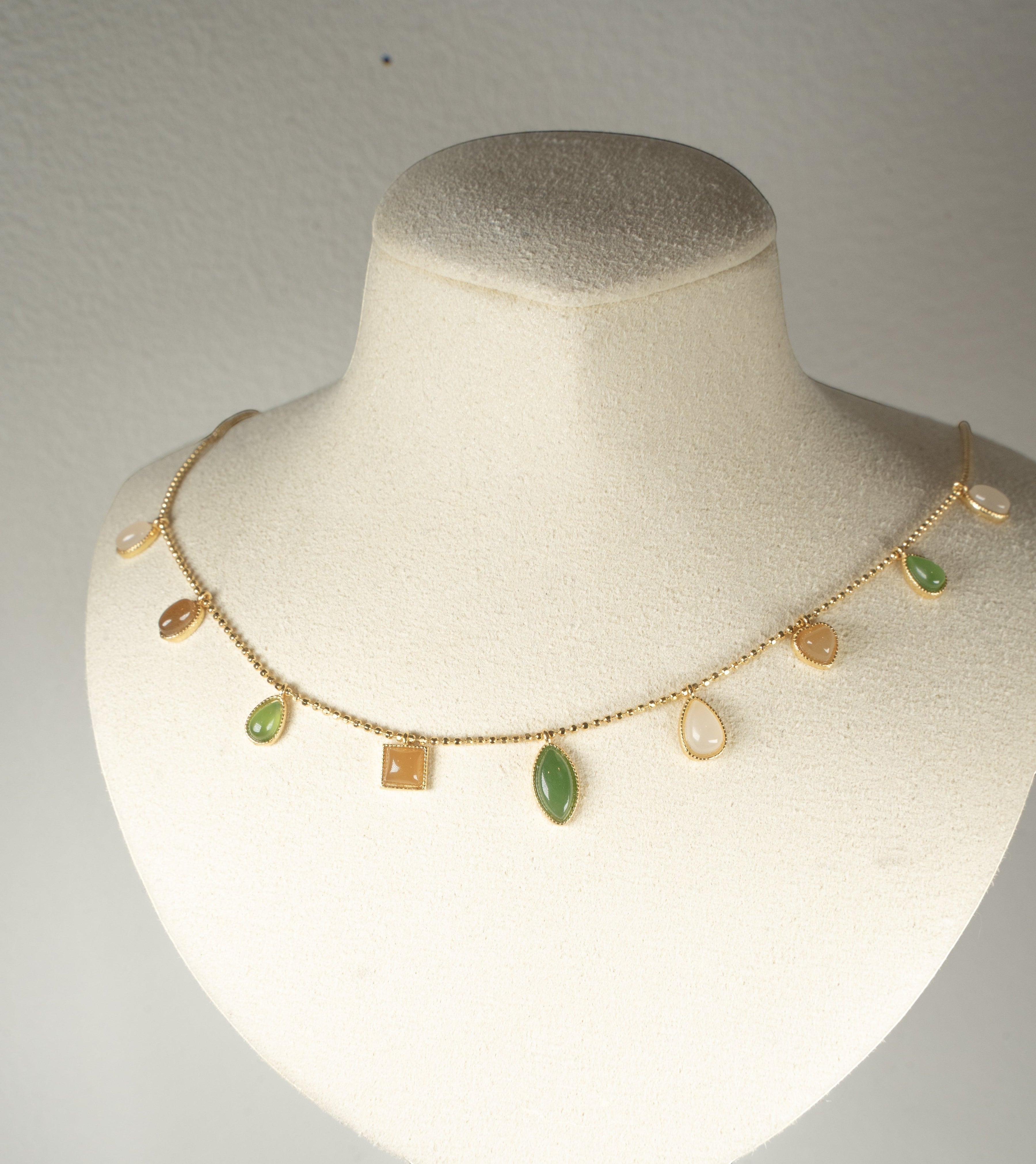 Findingyoyo necklace featuring multi-shaped Hetian jade stones in five elemental tones with gold vermeil accents.