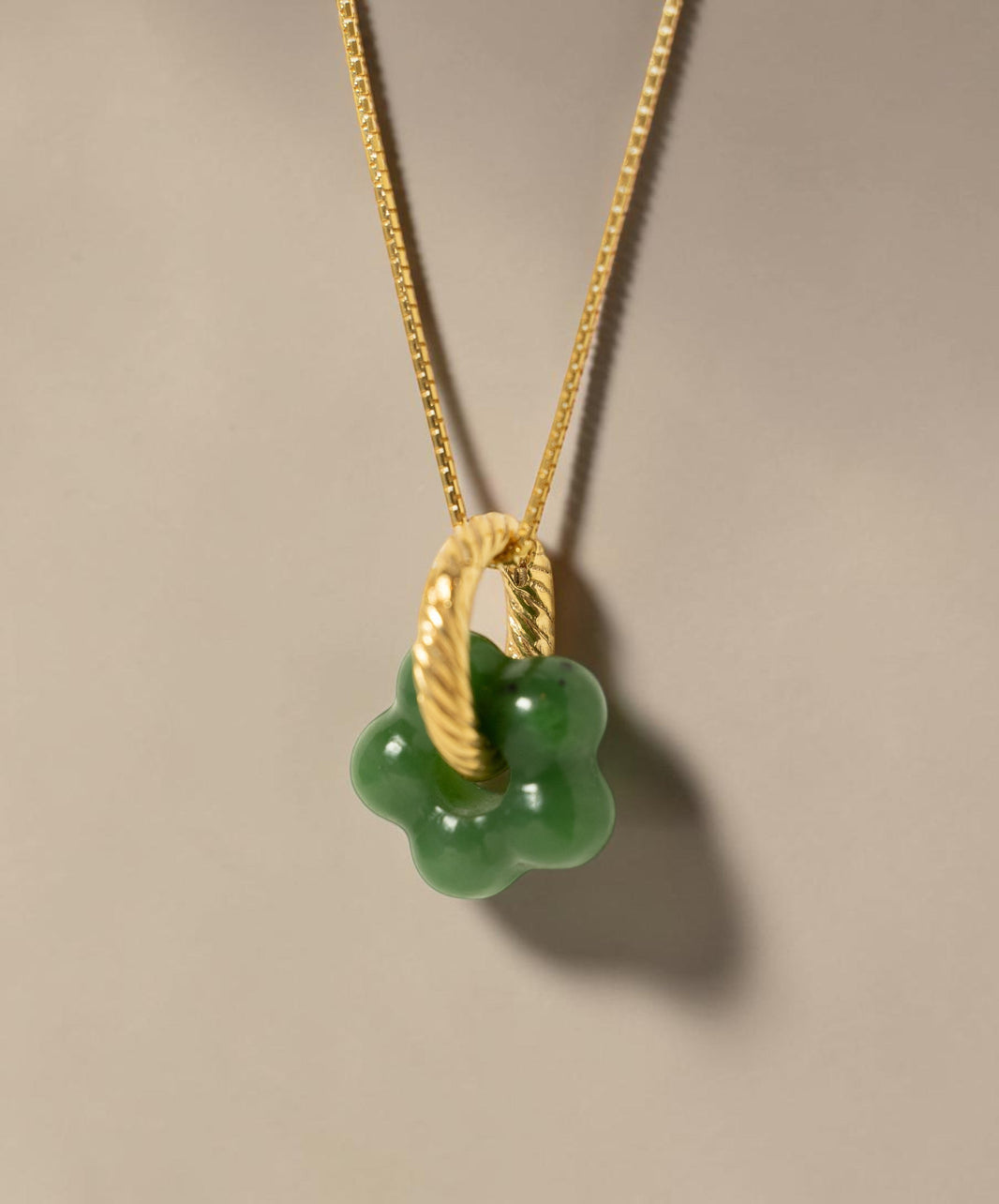 Findingyoyo Jardin necklace featuring a hand-carved green Hetian jade flower pendant on an 18K gold vermeil chain.