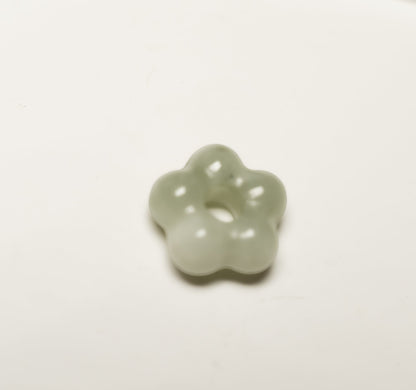 Findingyoyo Jardin Necklace featuring a hand-carved pale celadon Hetian jade flower pendant with a smooth finish.