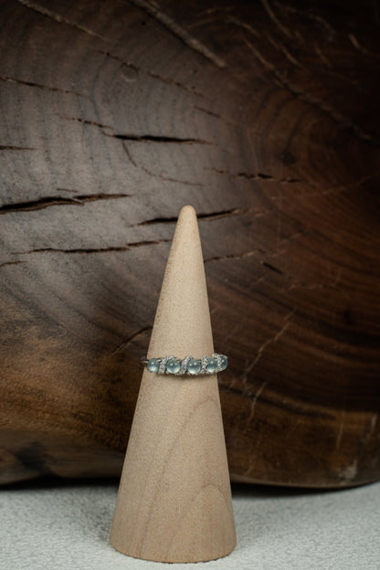 Findingyoyo adjustable ring featuring blue Guatemalan jadeite stones and zircon accents set in rhodium-plated silver.