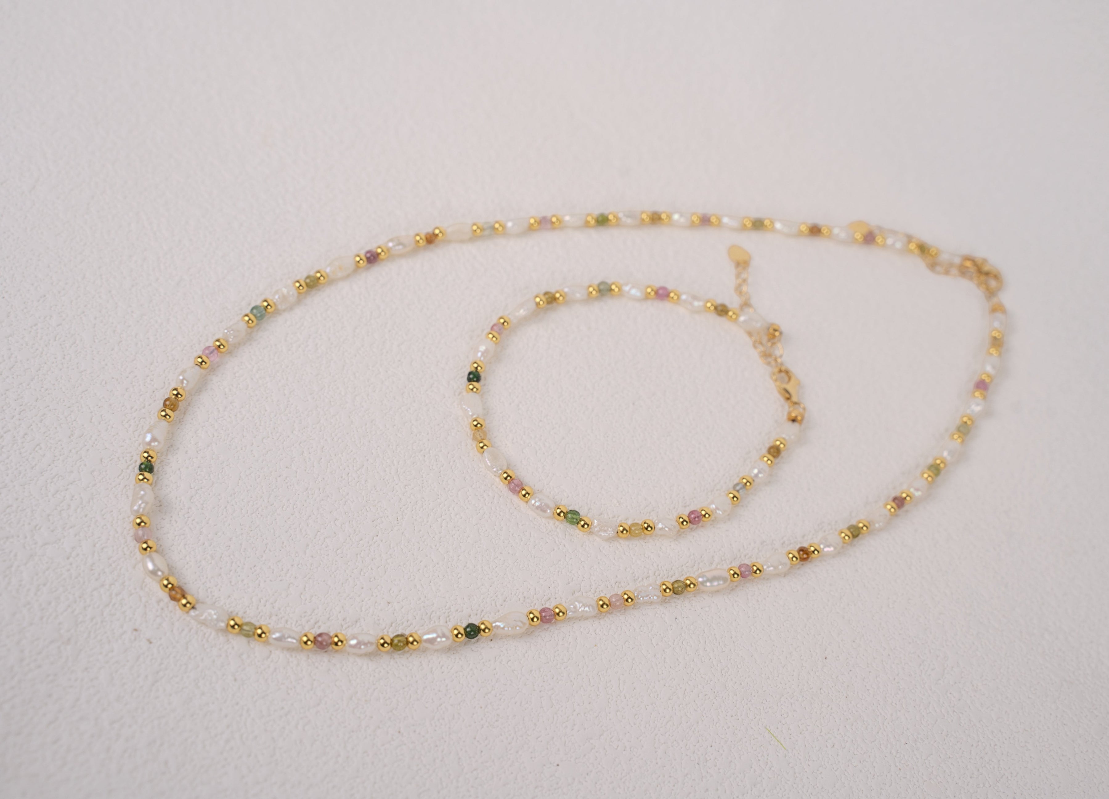 Findingyoyo Skittles set featuring a gold vermeil necklace and bracelet with natural tourmaline and keshi pearls.