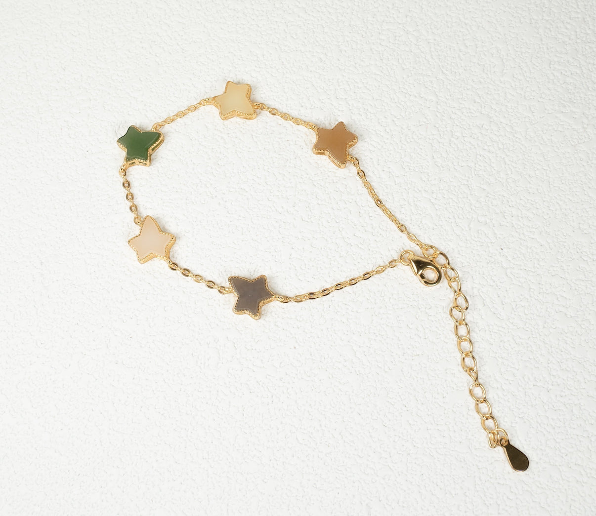 Findingyoyo Full Fortune bracelet featuring star-shaped multi-colored Hetian jade beads with gold vermeil accents.