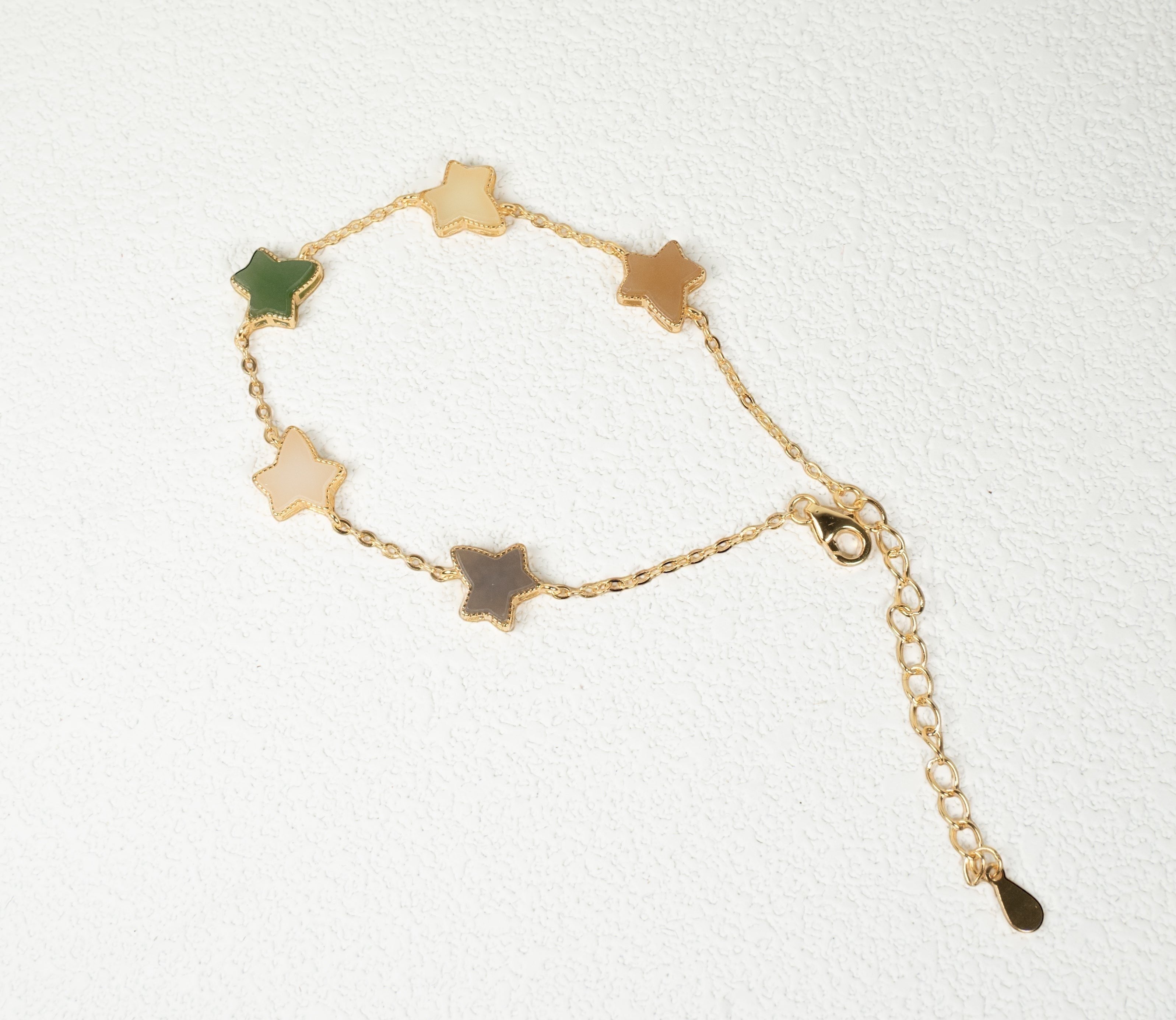 Findingyoyo Full Fortune bracelet featuring star-shaped multi-colored Hetian jade beads with gold vermeil accents.