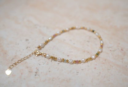 Findingyoyo Skittles bracelet featuring natural tourmaline stones and freshwater keshi pearls on gold vermeil chain.