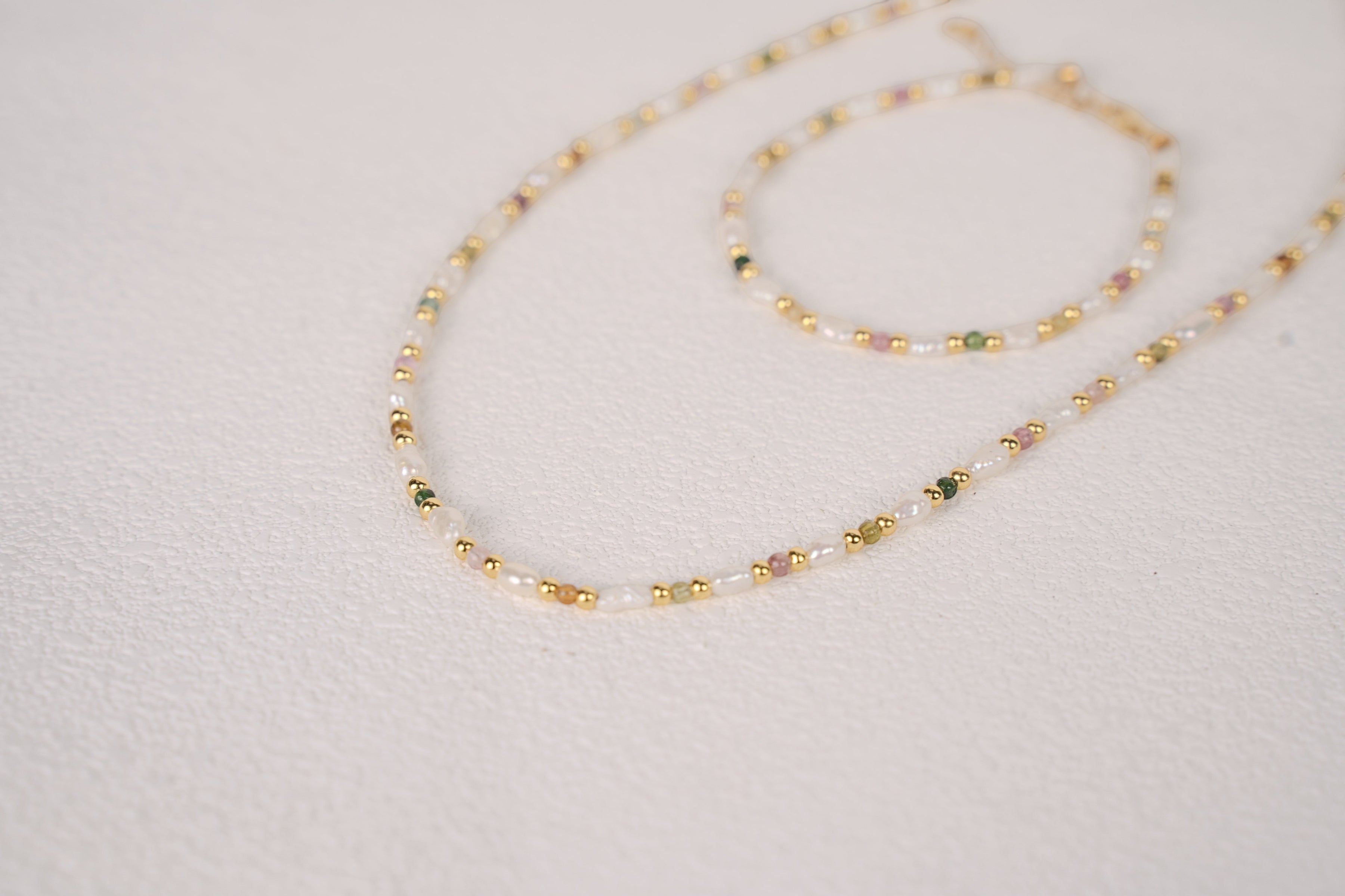 Findingyoyo Skittles set featuring a gold vermeil necklace and bracelet with natural tourmaline and keshi pearls.