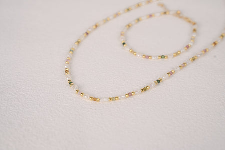 Findingyoyo Skittles set featuring a gold vermeil necklace and bracelet with natural tourmaline and keshi pearls.