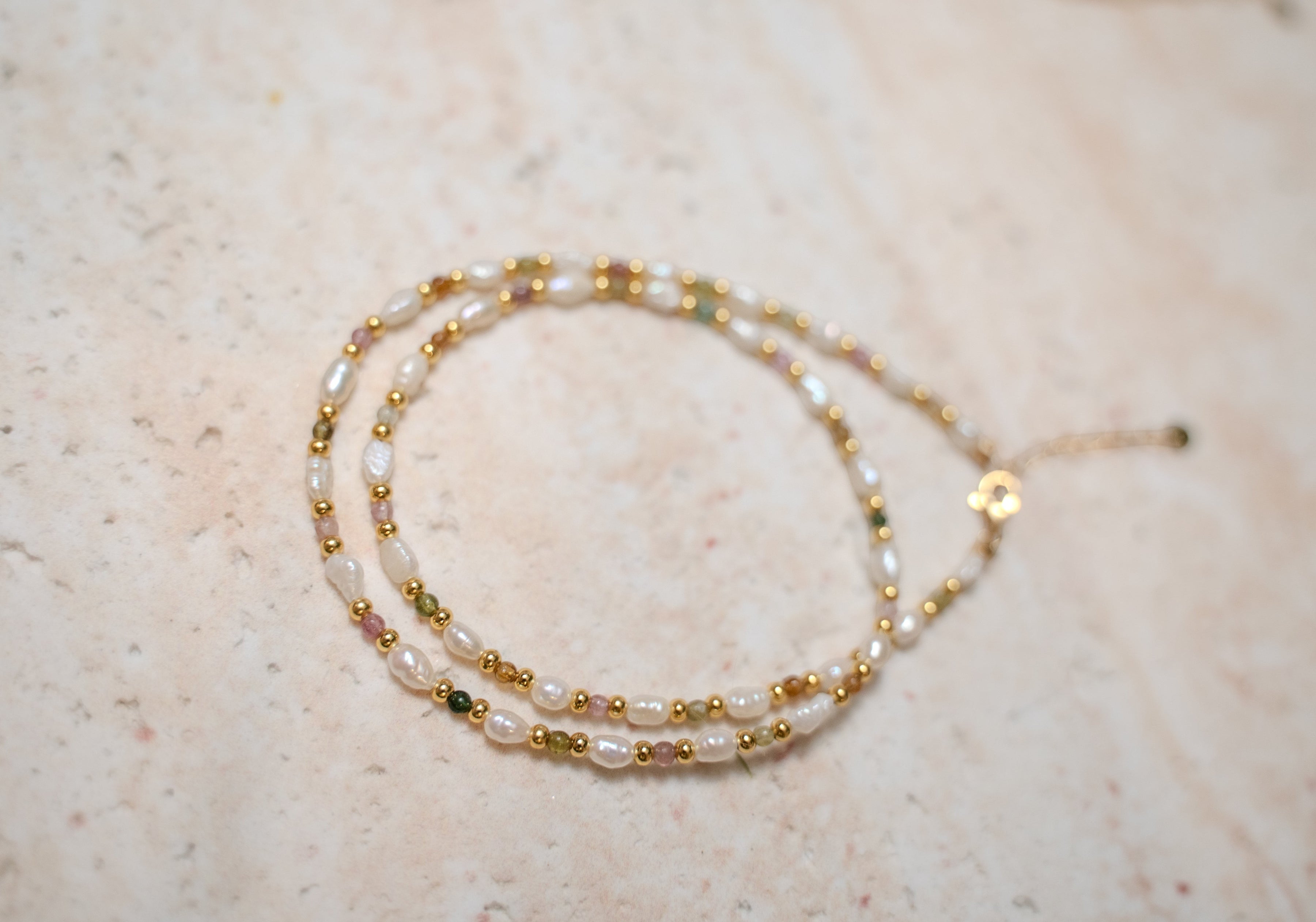 Findingyoyo Skittles necklace featuring natural tourmaline stones and freshwater keshi pearls on a gold vermeil chain.