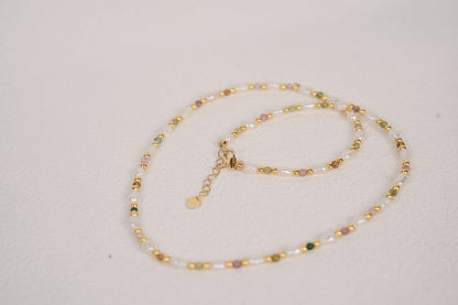 Findingyoyo Skittles necklace featuring multicolored natural tourmaline stones and freshwater keshi pearls in gold vermeil