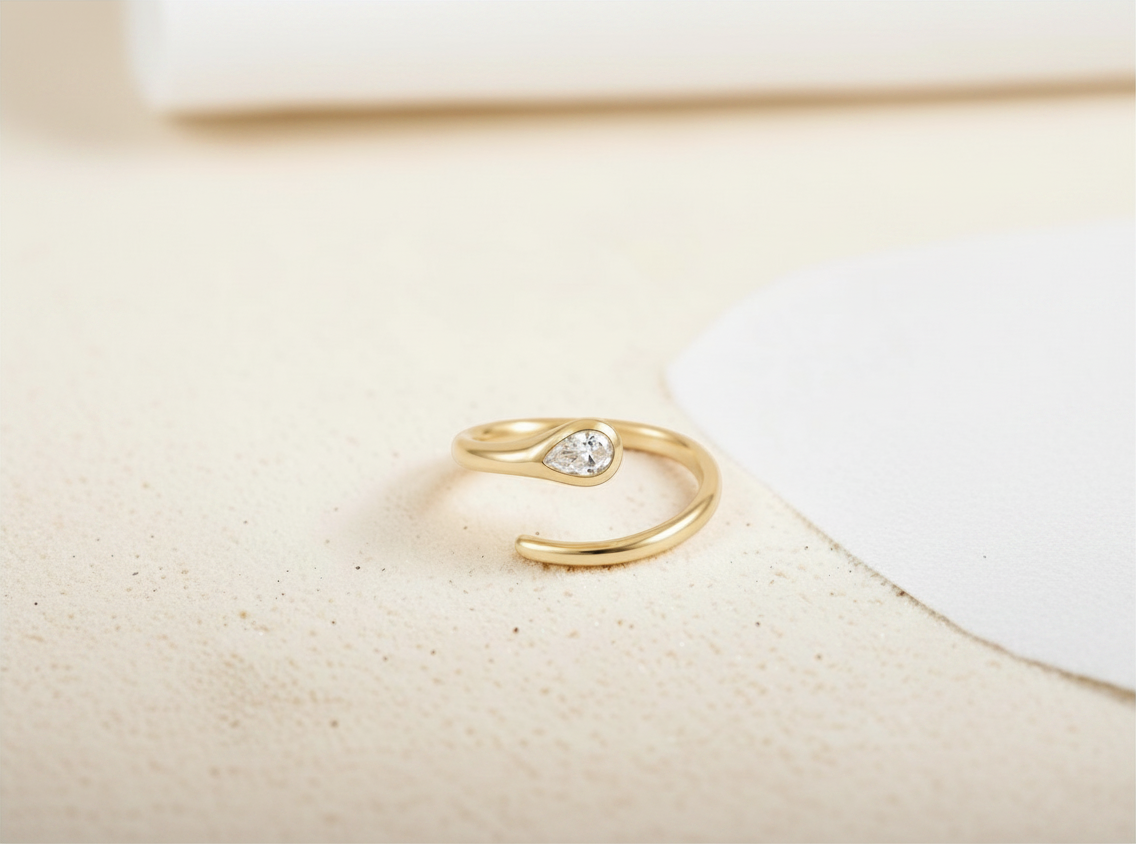 Findingyoyo Venus ring featuring a tear-shaped lab-grown diamond set in solid 9K yellow gold with an adjustable band.