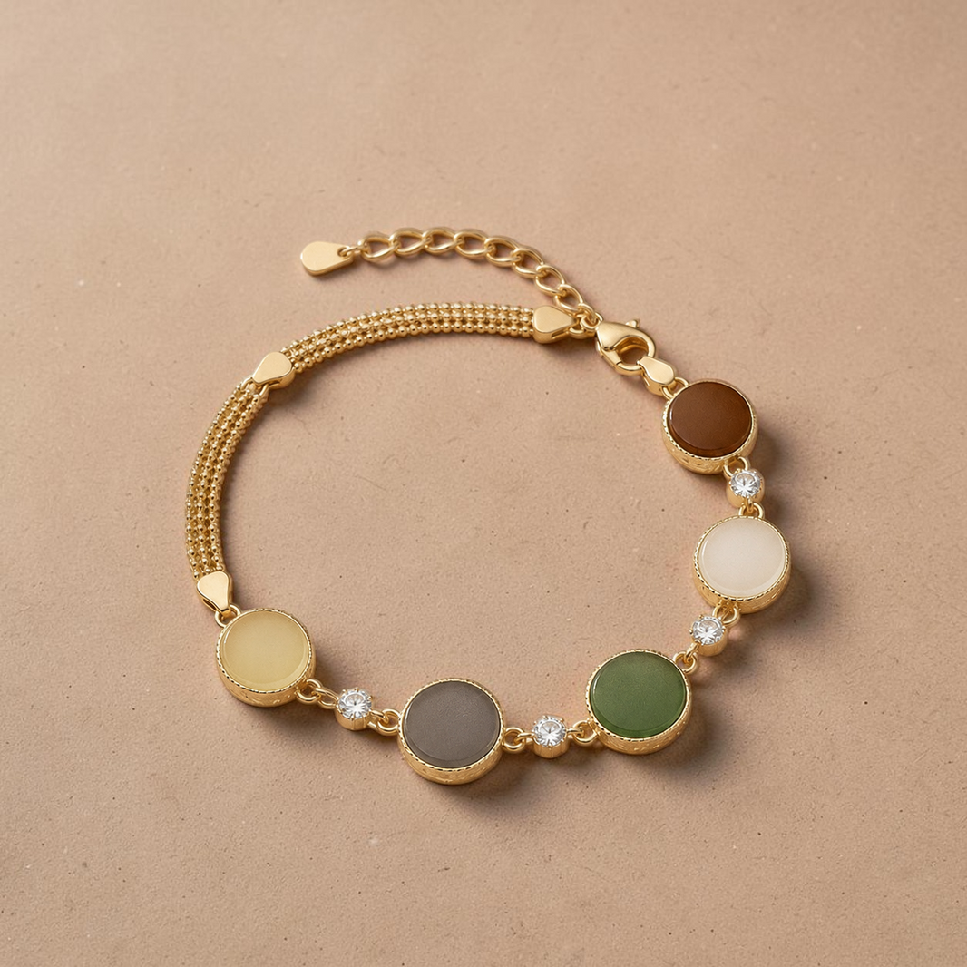 Findingyoyo Full Fortune bracelet featuring five-toned Hetian jade beads and gold vermeil accents on a beige background